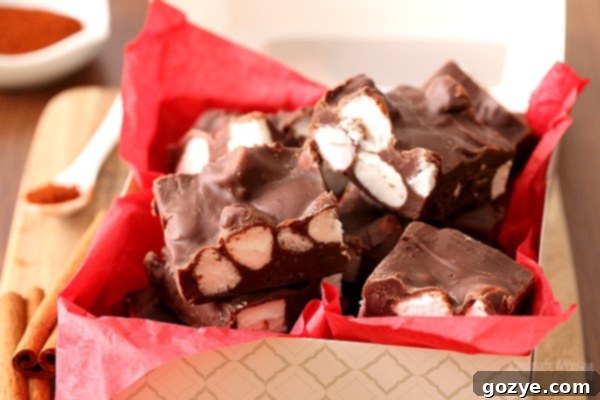 Spicy Mexican Chocolate Fudge 5 A block of firm Mexican Hot Chocolate Fudge being sliced into perfect, even squares on a cutting board, ready for serving