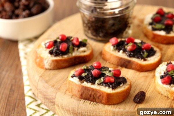 Sweet Raisin Jam and Creamy Goat Cheese Crostini 3 Raisin Jam and Goat Cheese Crostini with pomegranate seeds and fresh basil