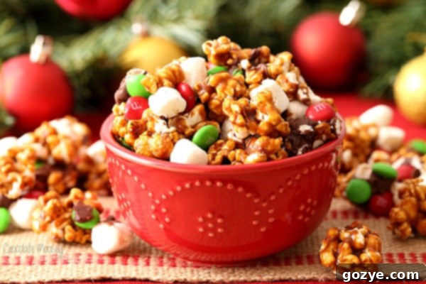Festive Christmas Popcorn 4 Christmas caramel popcorn with gingerbread coating in red holiday bowl decorated with candy