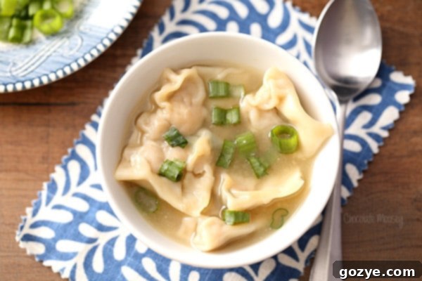 Pork Wonton Soup cooked in a Dutch oven for a cozy Chinese meal