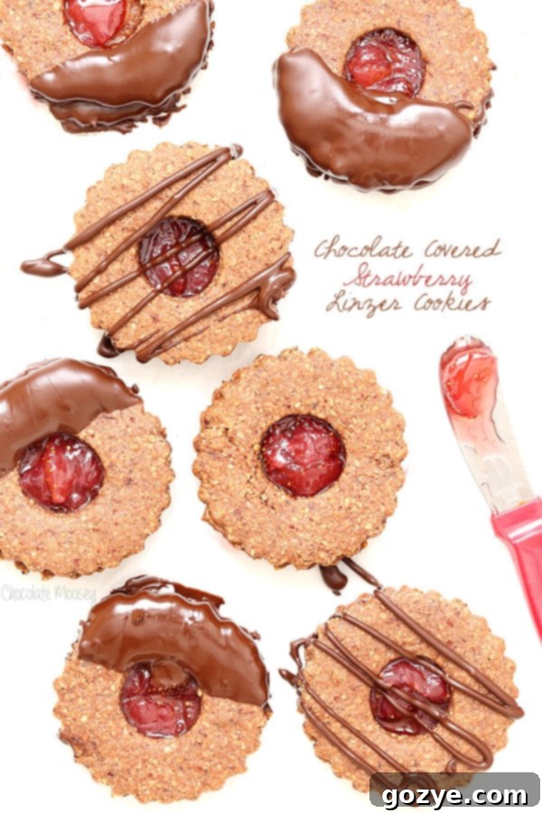 Chocolate Covered Strawberry Linzer Cookies made with hazelnut flour and strawberry jam