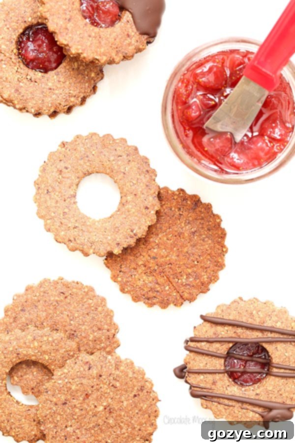 Chocolate Covered Strawberry Linzer Cookies made with hazelnut flour and strawberry jam