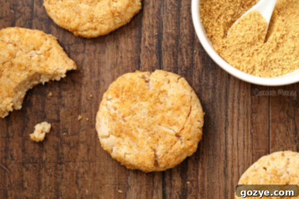 Cream Cheese Cookies being rolled in graham cracker crumbs