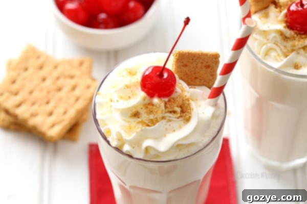 Decadent Cheesecake Shakes 3 Easy to make Cheesecake Milkshakes served in clear glasses with garnishes