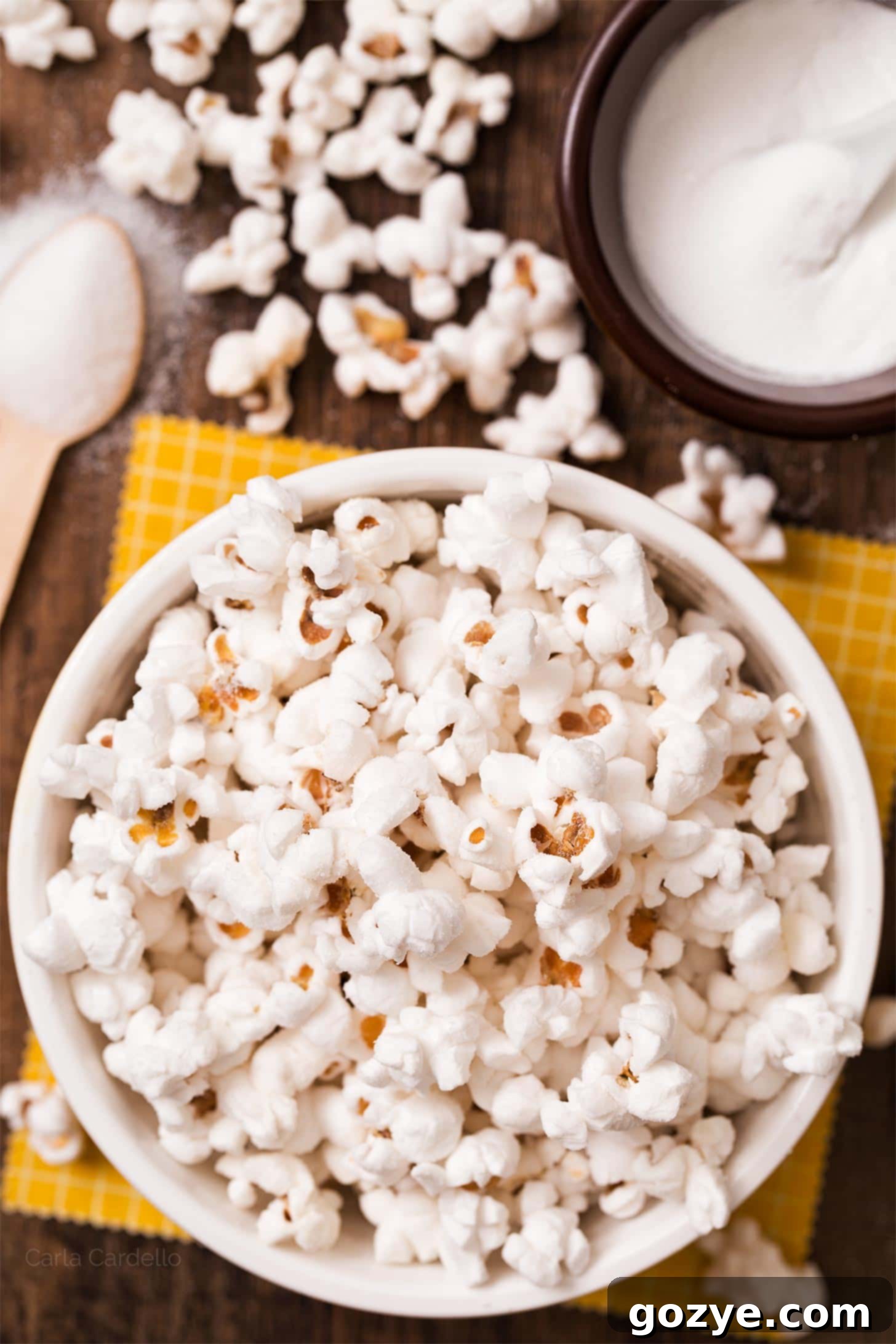 An overflowing bowl of homemade salt and vinegar popcorn, perfectly seasoned and ready to eat.