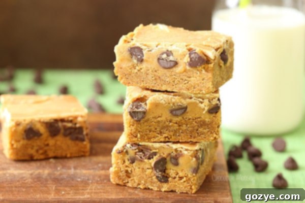 Triple Peanut Butter Cookie Dough Blondies with a Bite Taken