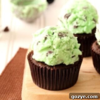 Chocolate mint cupcakes with scoop of mint buttercream frosting
