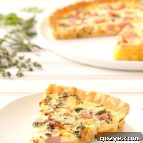 The finished Ham and Herb Quiche, a perfect brunch meal, beautifully baked