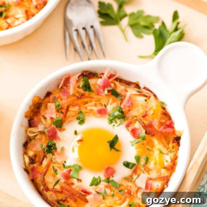 Hash brown bowls with baked egg in middle, recipe card image