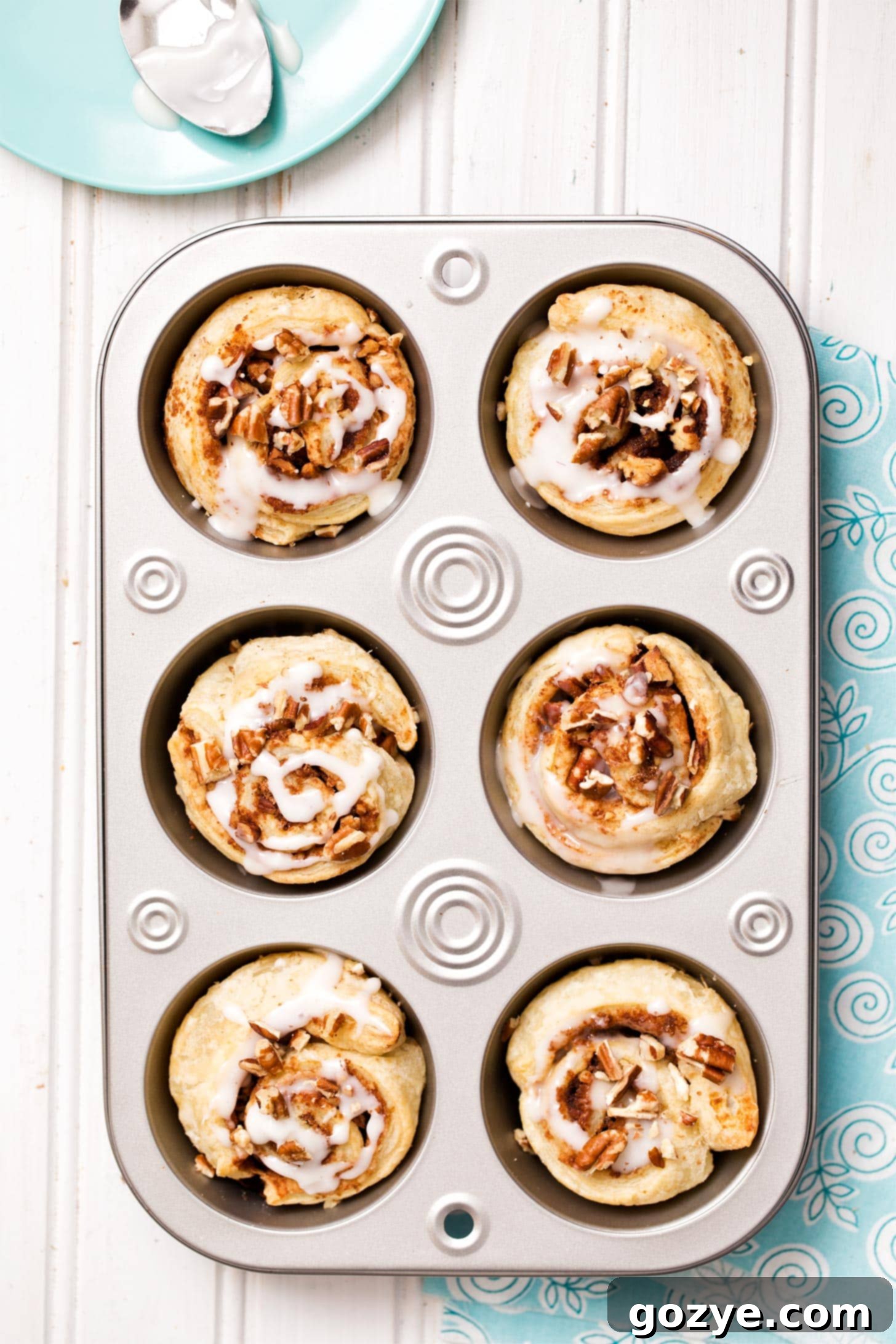 Puff pastry cinnamon rolls in a muffin pan