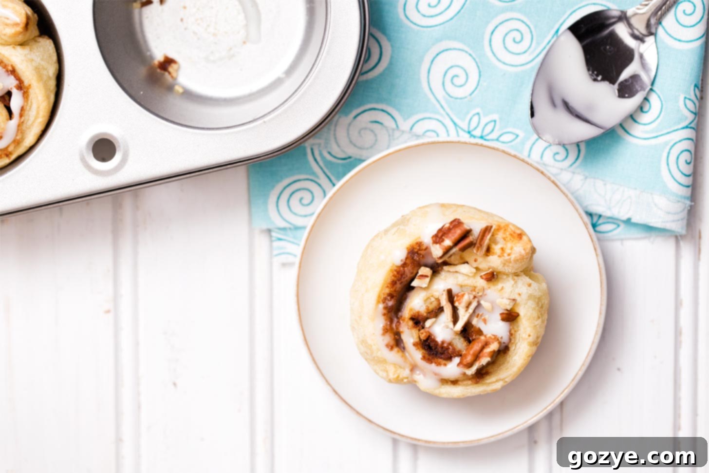 Puff pastry cinnamon roll on white plate