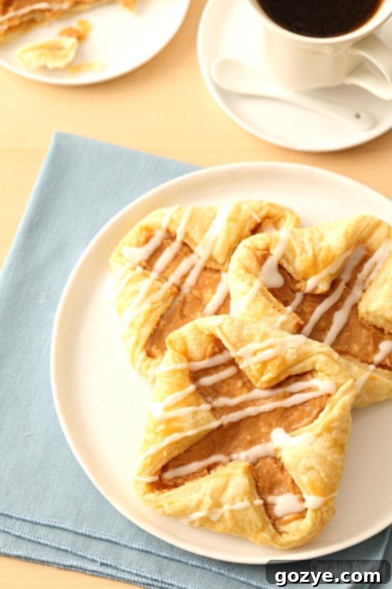 Flaky Danish Pastries 3 Puff Pastry Danishes on white plate