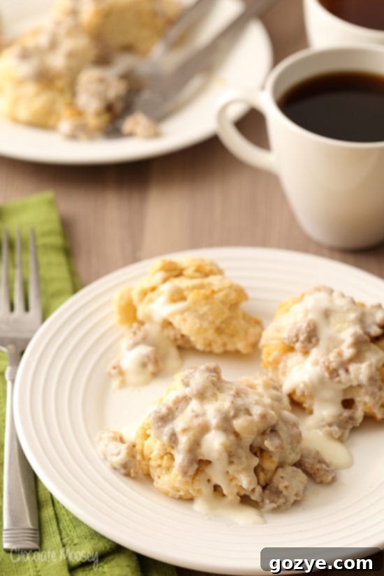 Biscuits and Gravy For Two on white plate with green linen