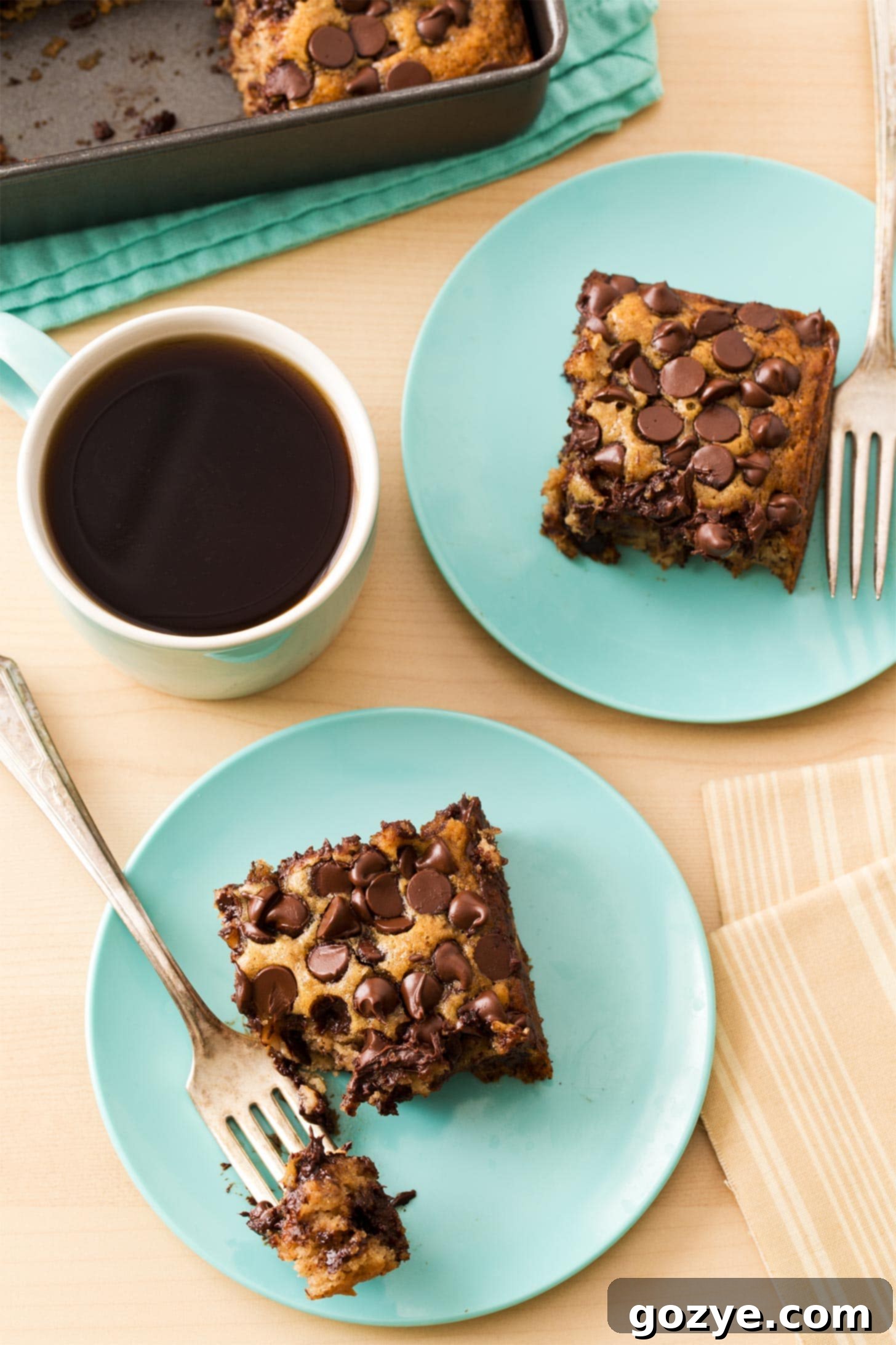 Banana Snack Cake slices on blue plates