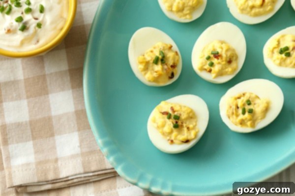 Close-up of French Onion Dip Deviled Eggs, garnished with fresh chives