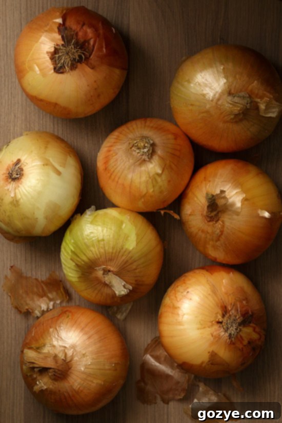 Pile of fresh Vidalia Onions on a rustic wooden surface