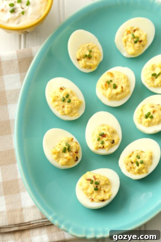 A tray of French Onion Dip Deviled Eggs ready for a summer picnic