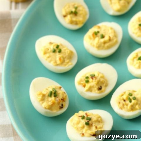 French Onion Dip Deviled Eggs with chives garnish