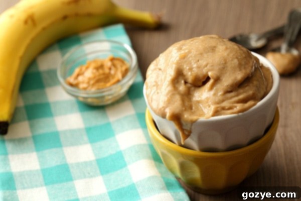 Small bowl of freshly made Peanut Butter Banana Ice Cream with a spoon, ready to be enjoyed