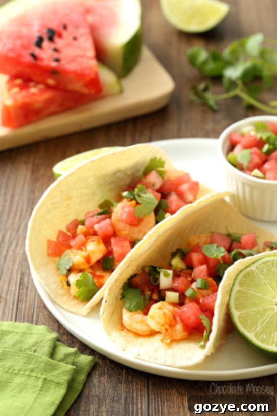 Spicy Sriracha Shrimp Tacos 3 Sriracha Shrimp Tacos on white plate with watermelon salsa