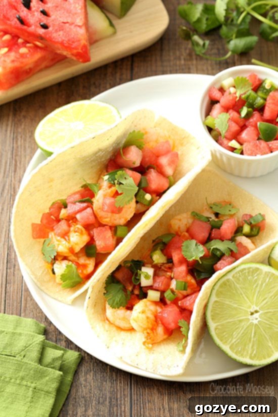 Spicy Sriracha Shrimp Tacos 5 Honey Sriracha Shrimp Tacos on plate with lime and salsa
