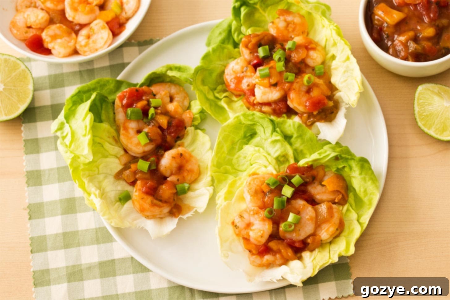 Shrimp Lettuce Boats on a white plate with salsa