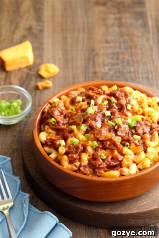 Ultimate Pulled Pork Mac and Cheese 5 A brown bowl of BBQ pulled pork mac and cheese, ready to be served