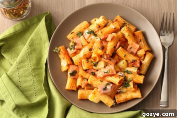 Hawaiian Pizza Pasta made with homemade tomato sauce, ham, pineapple, and mozzarella cheese