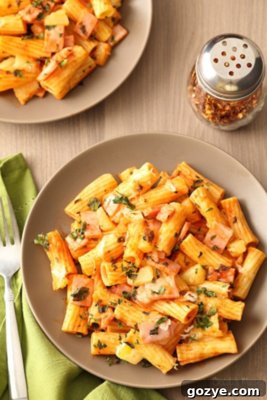 Hawaiian Pizza Pasta made with homemade tomato sauce, ham, pineapple, and mozzarella cheese