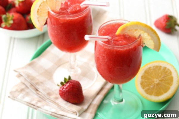 Boozy or Virgin Strawberry Slushies 3 Two glasses strawberry slush on turquoise tray