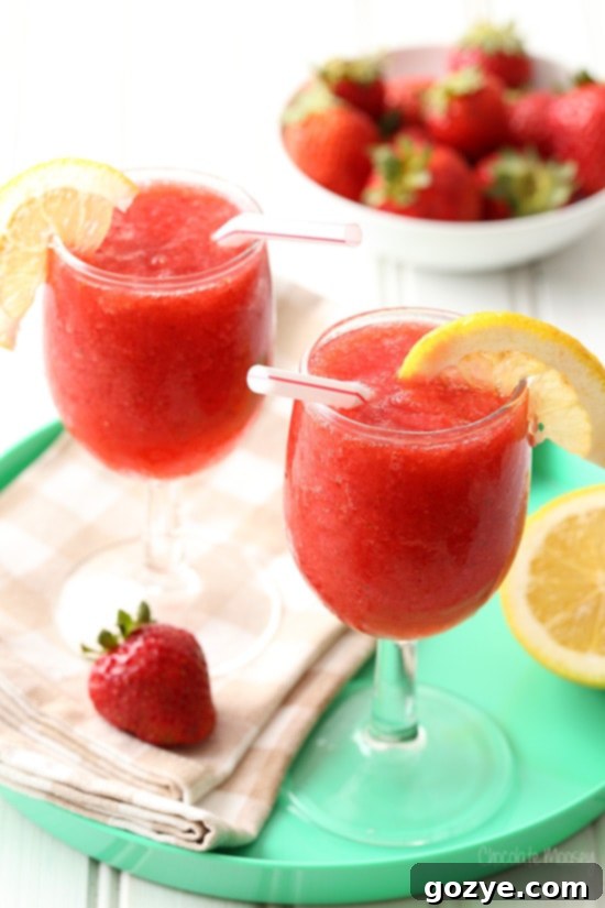 Boozy or Virgin Strawberry Slushies 4 Two glasses strawberry slush on turquoise tray