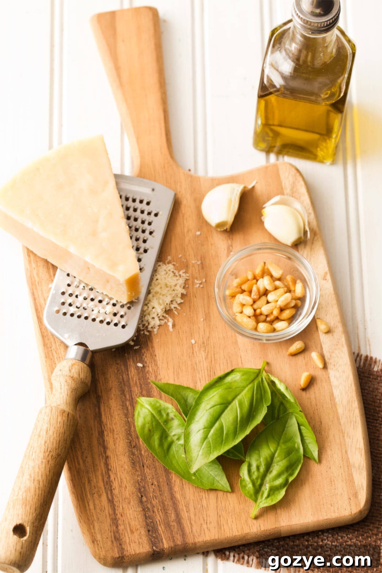 Preparing homemade basil pesto in a food processor