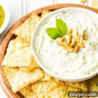 Pesto Dip in white bowl with chips