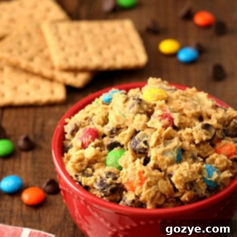 Homemade Monster Cookie Dough Dip with M&Ms, chocolate chips, and peanut butter.