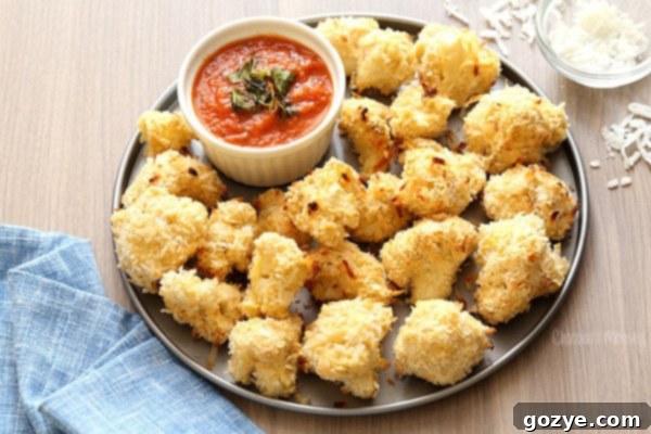 Coconut Crusted Baked Cauliflower Bites with homemade marinara sauce