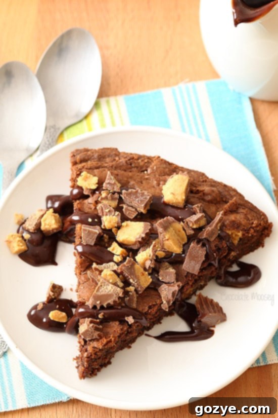 Close-up of Peanut Butter Cup Brownie Pie with melty peanut butter cups