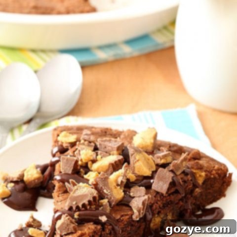 A whole Peanut Butter Cup Brownie Pie, ready to be served