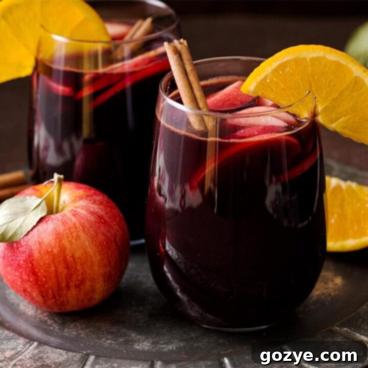 Red Apple Cider Sangria with orange and cinnamon