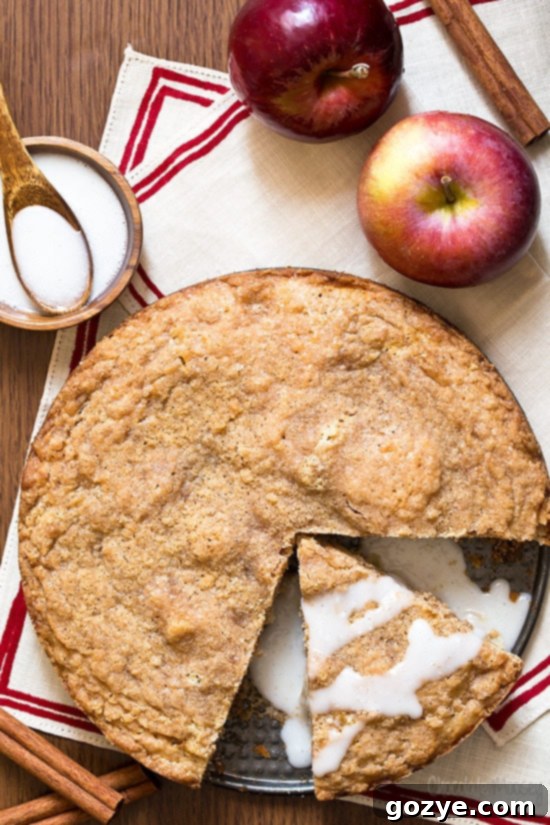 Delicious Apple Cinnamon Coffee Cake with crumb topping and vanilla glaze, ready to be served