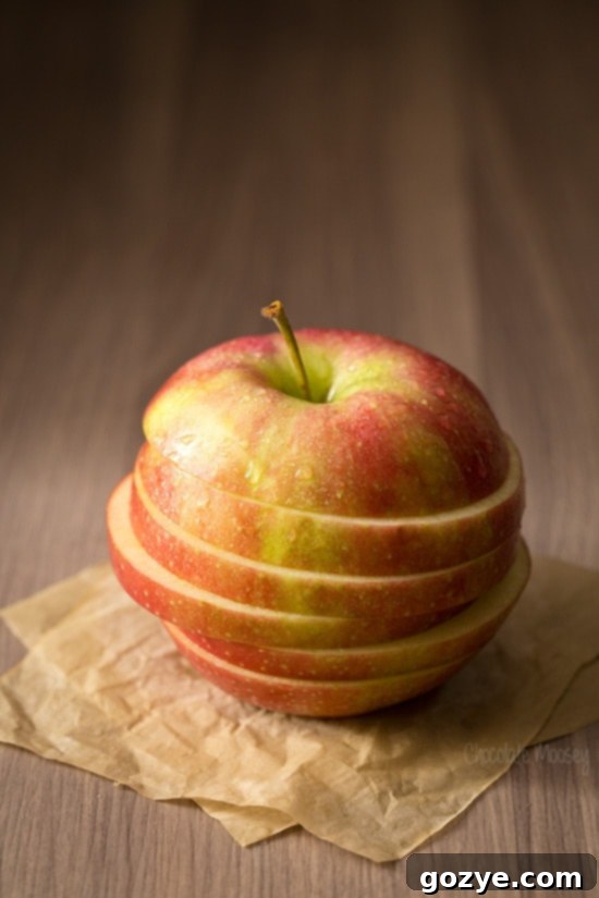 Close-up of a perfectly sliced apple, showcasing its crisp texture and appealing color