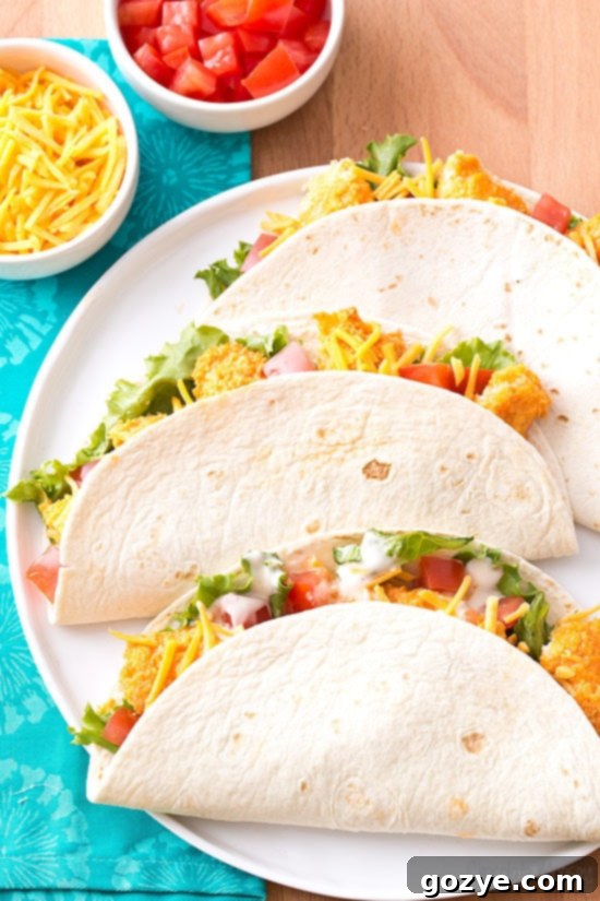 Zesty Buffalo Chicken Tacos 4 3 Buffalo Chicken Tacos with crispy baked buffalo chicken strips and fresh toppings