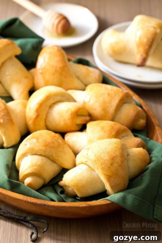Homemade crescent rolls in a rustic basket, ready to be served