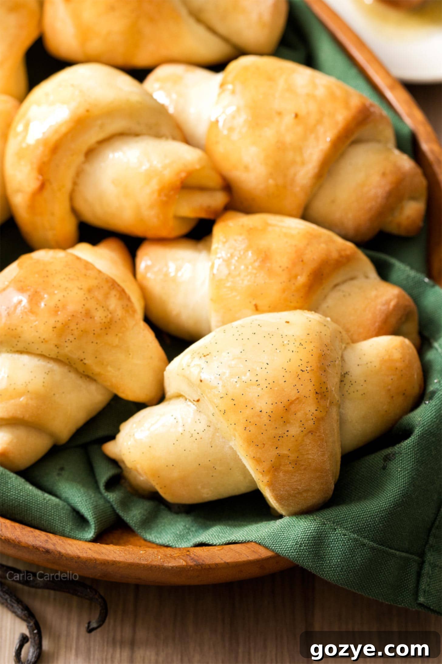 Close up of a basket of freshly baked honey butter crescent rolls