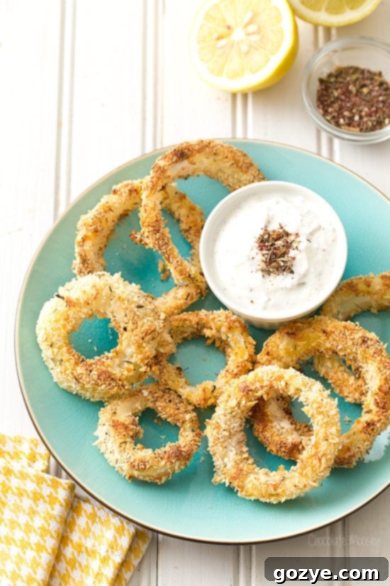 Crispy Za'atar Baked Onion Rings with a side of dipping sauce