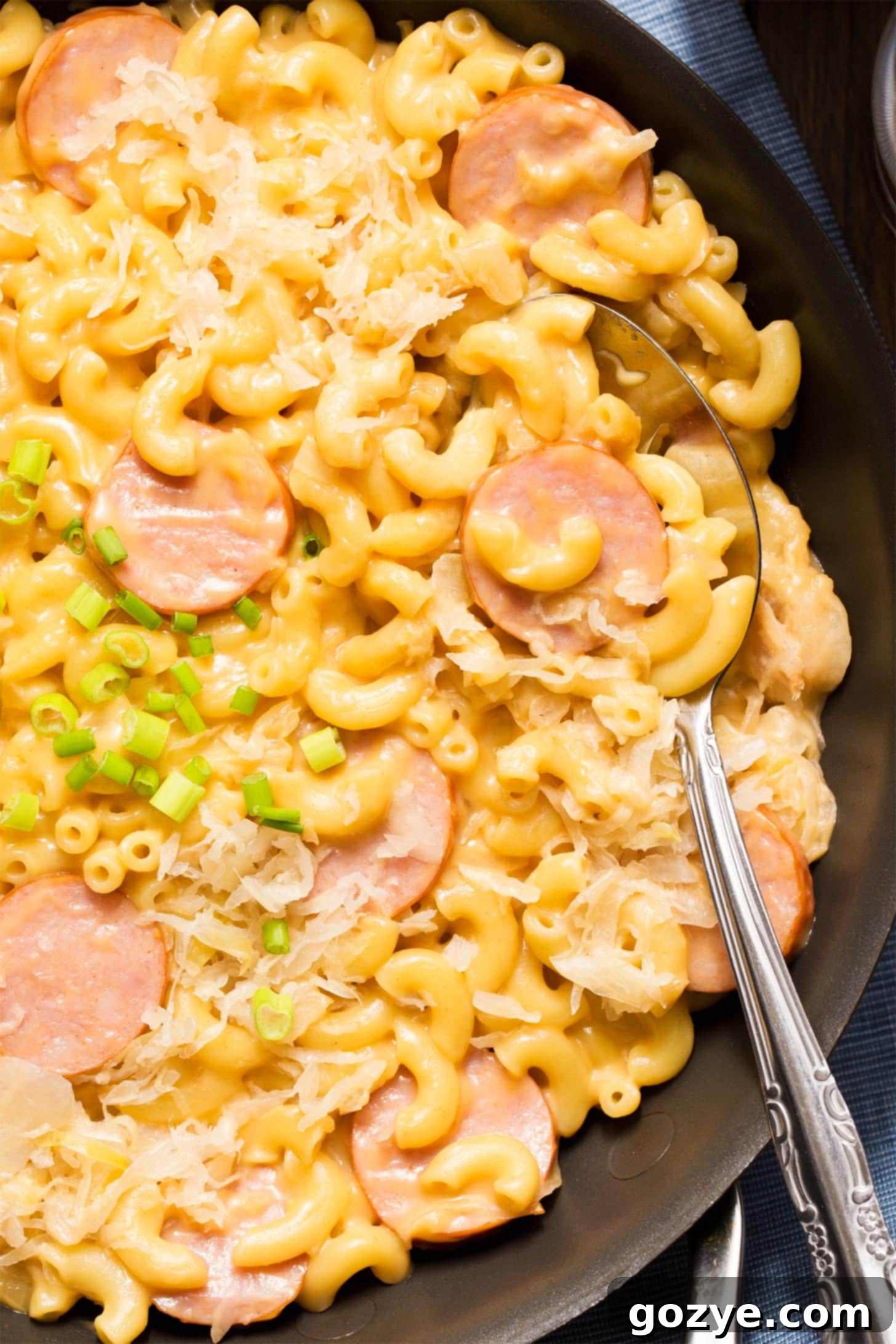 Close up of kielbasa mac and cheese in skillet