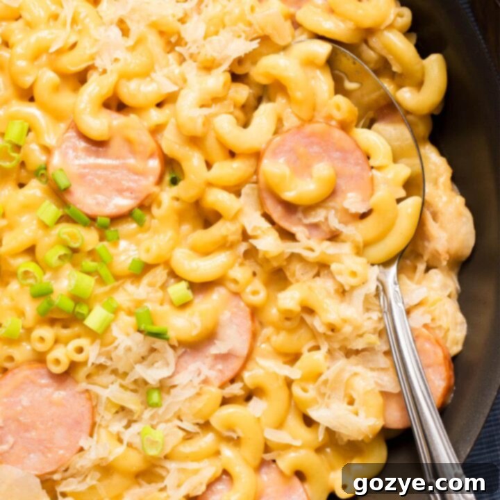 Close up of kielbasa mac and cheese in skillet