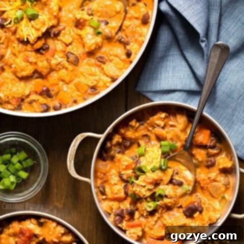 Hearty Buffalo Chicken Chili 5 Buffalo Chicken Chili in small bowls with spoon