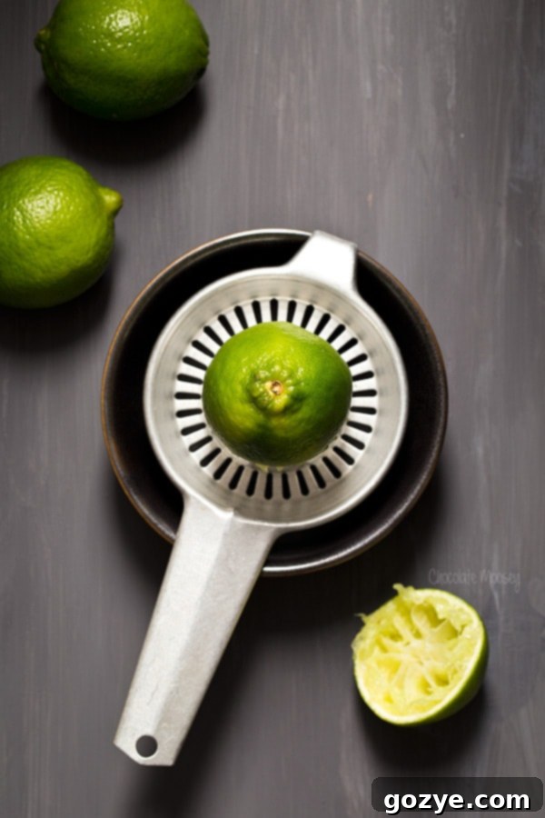Lime and Tequila Cheesecake Bites 4 Hand juicing limes for Mini Margarita Cheesecakes
