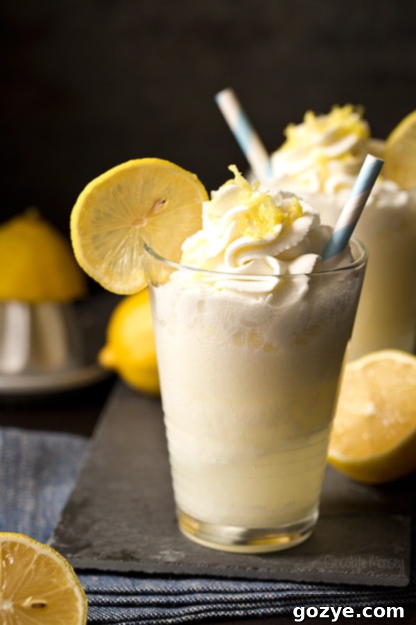 Refreshing Lemon Drop Cream Soda served in a glass with a lemon slice garnish.