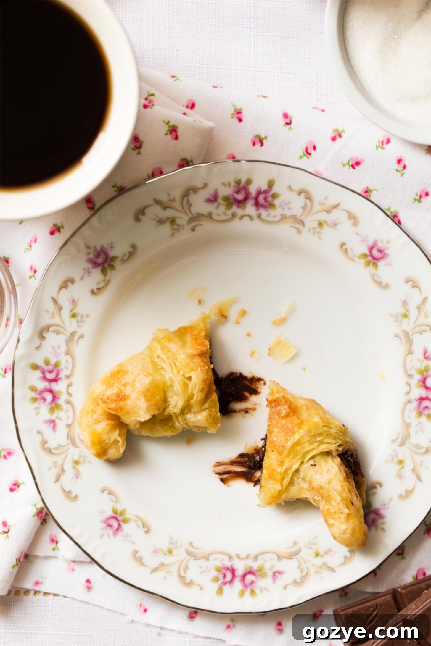 Close up of Puff Pastry Chocolate Croissants on pretty flower plate
